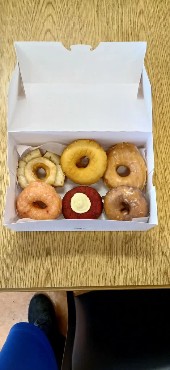 A half dozen assorted classic donuts packed in a Doughboys box