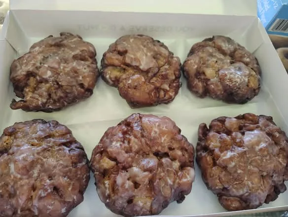 A half dozen glazed apple fritters