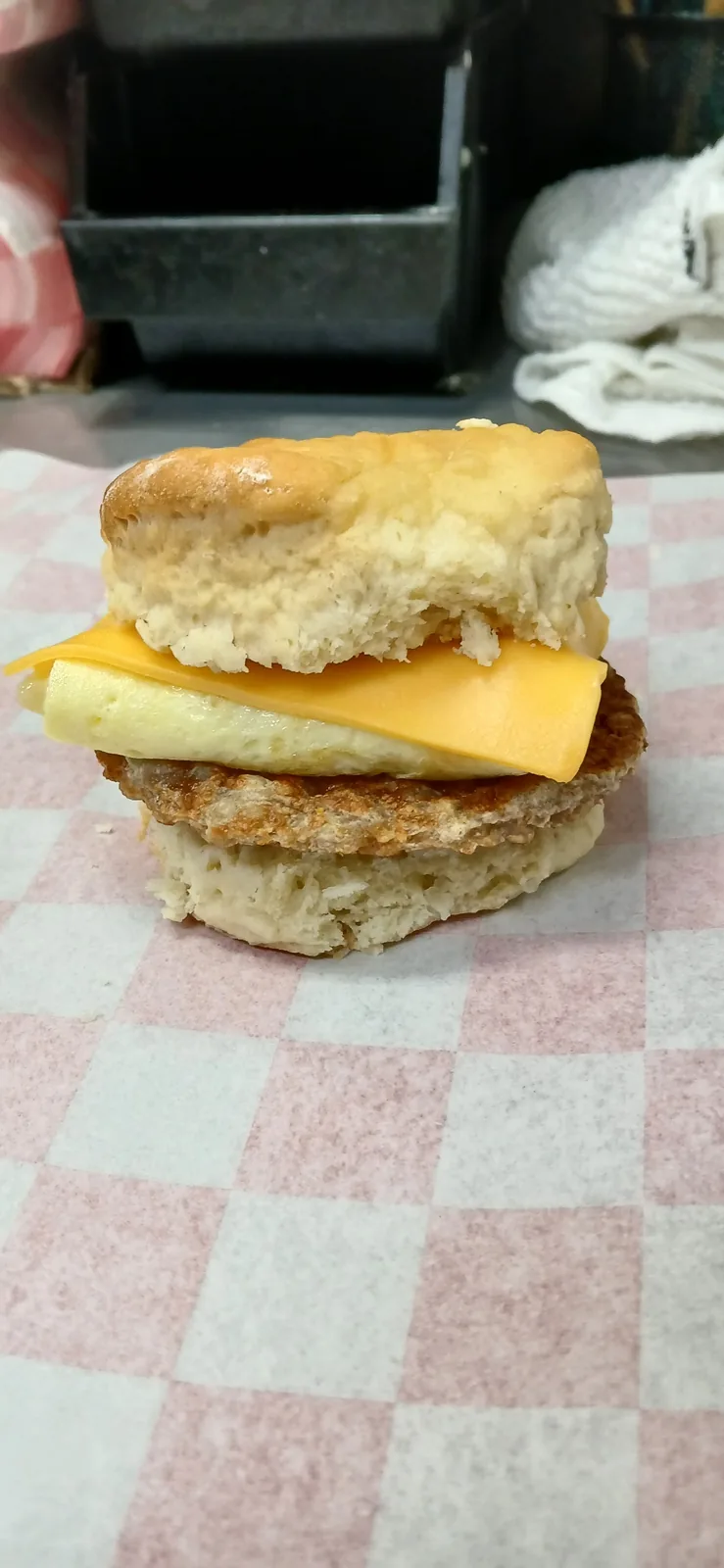 A biscuit breakfast sandwich with egg and cheese